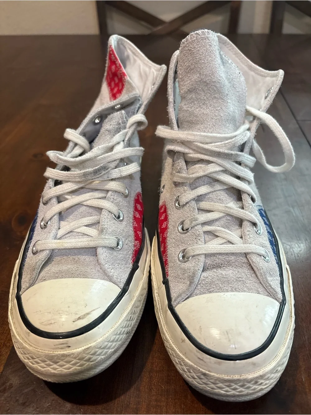 Converse Chuck Taylor’s White High Top Sneakers with Red and Blue Accents